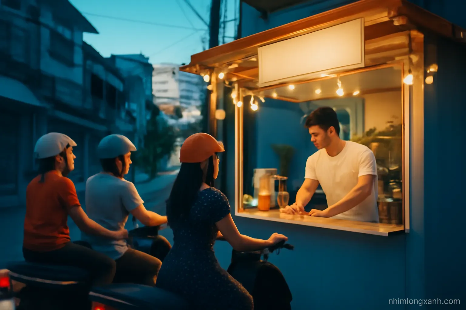 Wide shot of a tiny Vietnamese street-side drink kiosk at dusk, young owner wiping the counter while customers on motorbikes wait, string lights, deep blue and warm orange tones