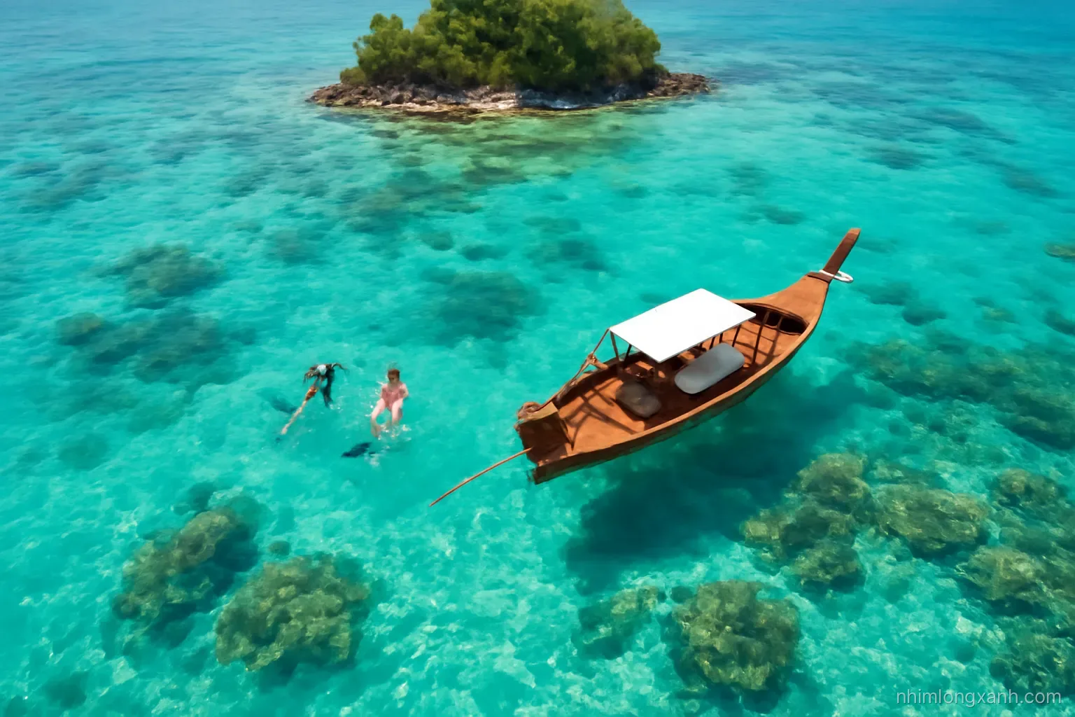 Top-down drone shot of a wooden longtail boat anchored over clear turquoise water and coral patches near a tiny island, Vietnamese snorkelers floating, bright midday sun