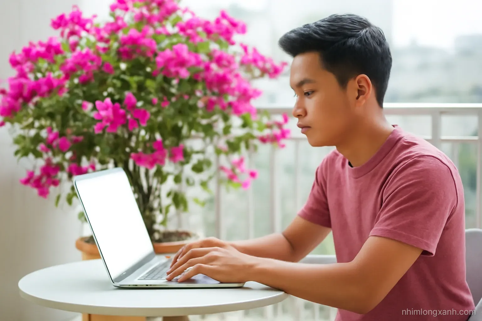 Side view of a young Vietnamese man typing on a laptop with a blank glowing screen at a balcony cafe table, potted bougainvillea behind, magenta and soft gray palette, afternoon light