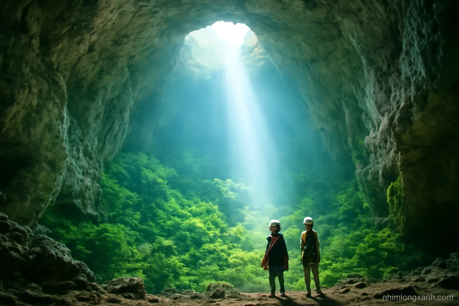 Tiny Vietnamese explorers with headlamps standing at the bottom of a colossal cave chamber, a shaft of sunlight falling through a skylight onto green jungle, wide shot, misty emerald light