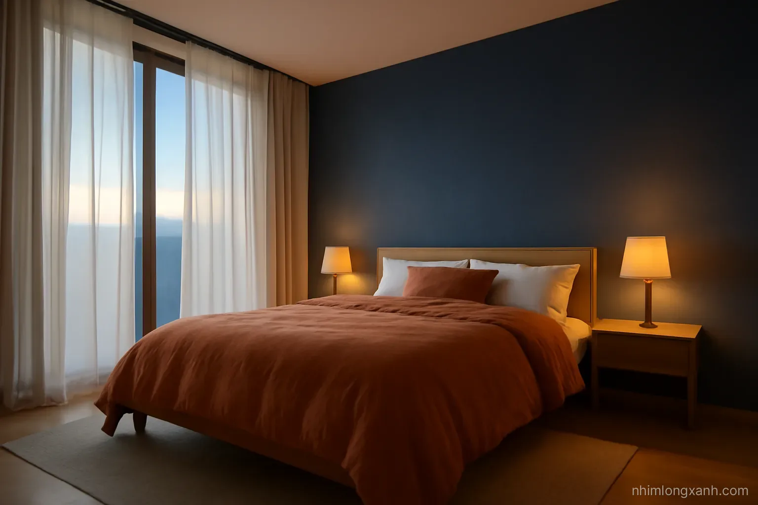 Low angle wide shot of a calm minimalist Vietnamese bedroom at dusk, linen bedding, warm dim bedside lamp, sheer curtains, deep indigo and amber color palette, nobody in frame