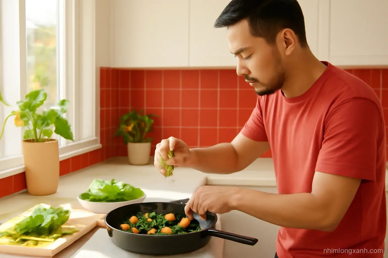 Side view of a bright Vietnamese kitchen where a man squeezes lime over a dark cast iron pan of stir-fried tofu and amaranth greens, warm afternoon light, red and green palette