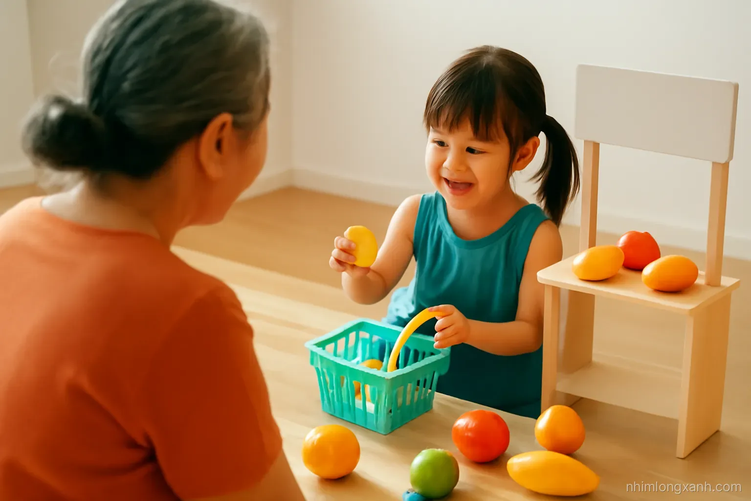 Over-the-shoulder view of a Vietnamese grandmother and a four-year-old girl playing pretend shop with fruits and a toy basket on a wooden floor, warm afternoon light, orange and teal